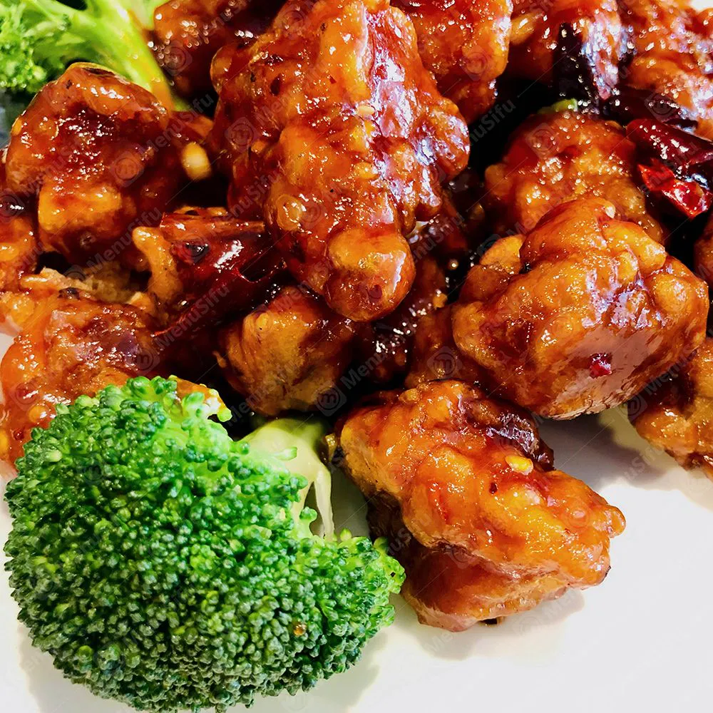 General Tso's crispy glazed chicken bites served with broccoli florets at Sichuan Wok, a Chinese Restaurant in Troy