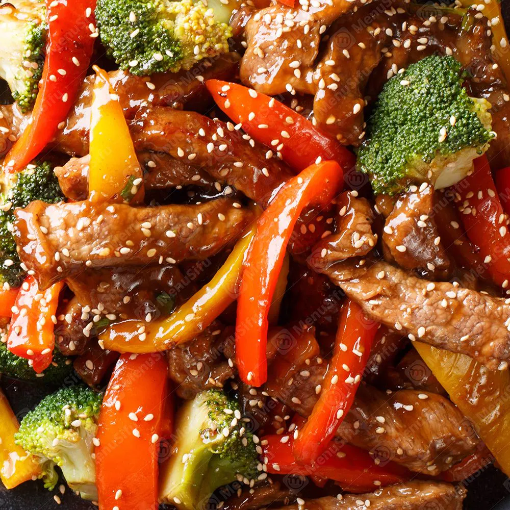 Three pepper beef stir fry with broccoli and mixed bell peppers sprinkled with sesame at Sichuan Wok, a Chinese Restaurant in Troy